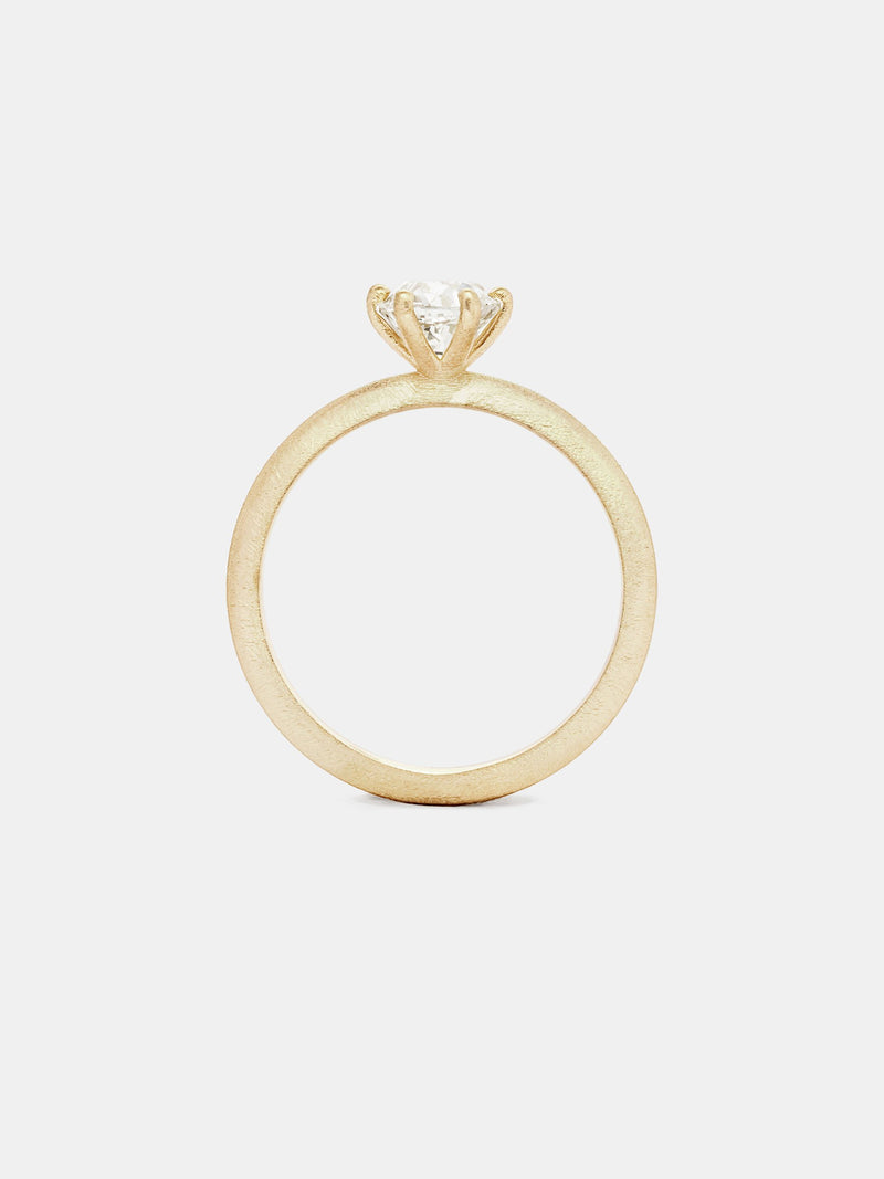 Classic Solitaire with 0.75ct near colorless antique diamond in 14k yellow gold with organic texture and signature matte finish.