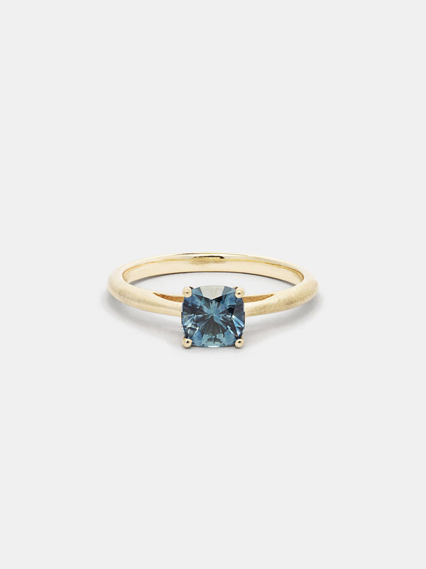 Shown: 1ct teal Montana sapphire in 14k yellow gold with smooth texture and signature matte finish. 