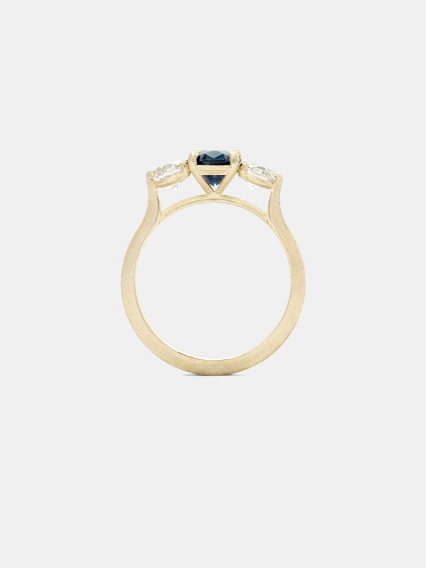 Shown: 1ct cobalt Montana sapphire with 0.3ct antique side stones in 14k yellow gold with organic texture and signature matte finish.