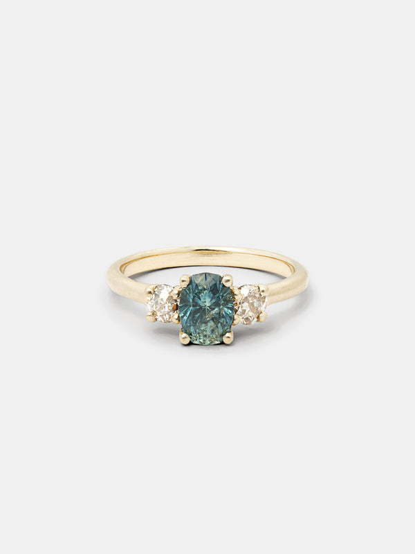 Shown: 1.ct mint oval Montana sapphire with 0.3ct side old European cut diamonds set in 14k yellow gold with smooth texture and signature matte finish. 